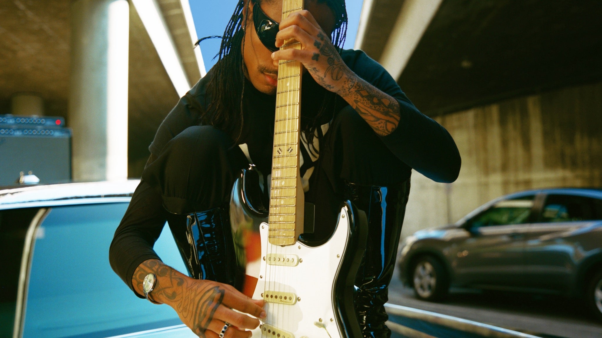 Steve Lacy posing with his Signature Fender "People Pleaser" Stratocaster
