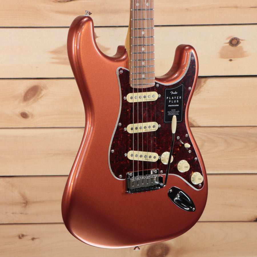 Fender Player Plus Stratocaster electric guitar Aged Candy Apple Red with single-coil pickups and tortoiseshell pickguard