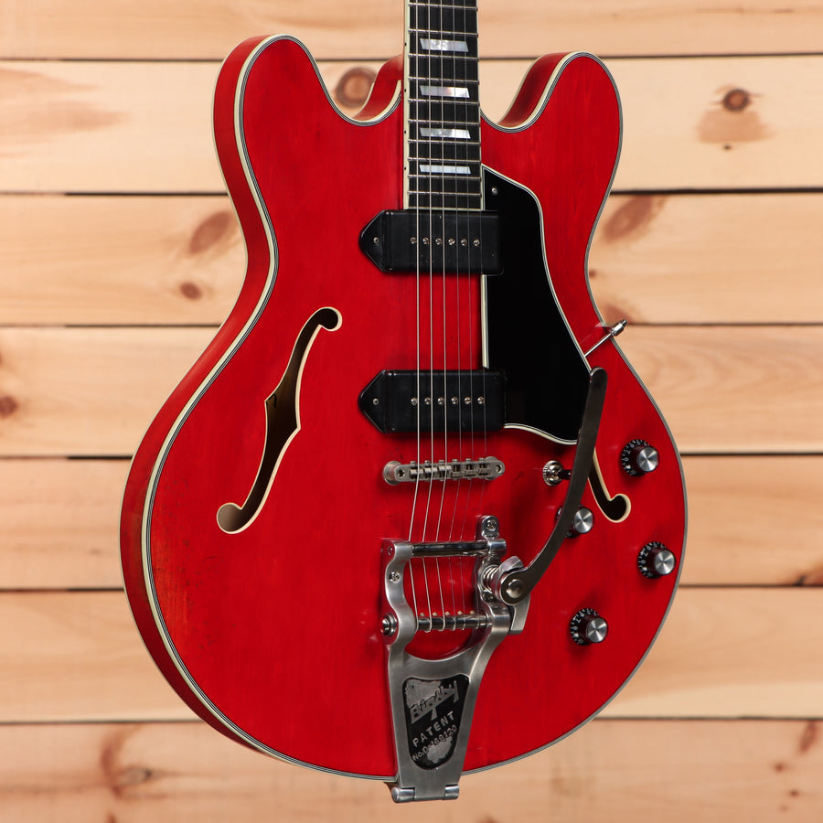 Eastman T64VRD semi-hollow electric guitar Antique Red with dual black pickguards and Bigsby tremolo bridge