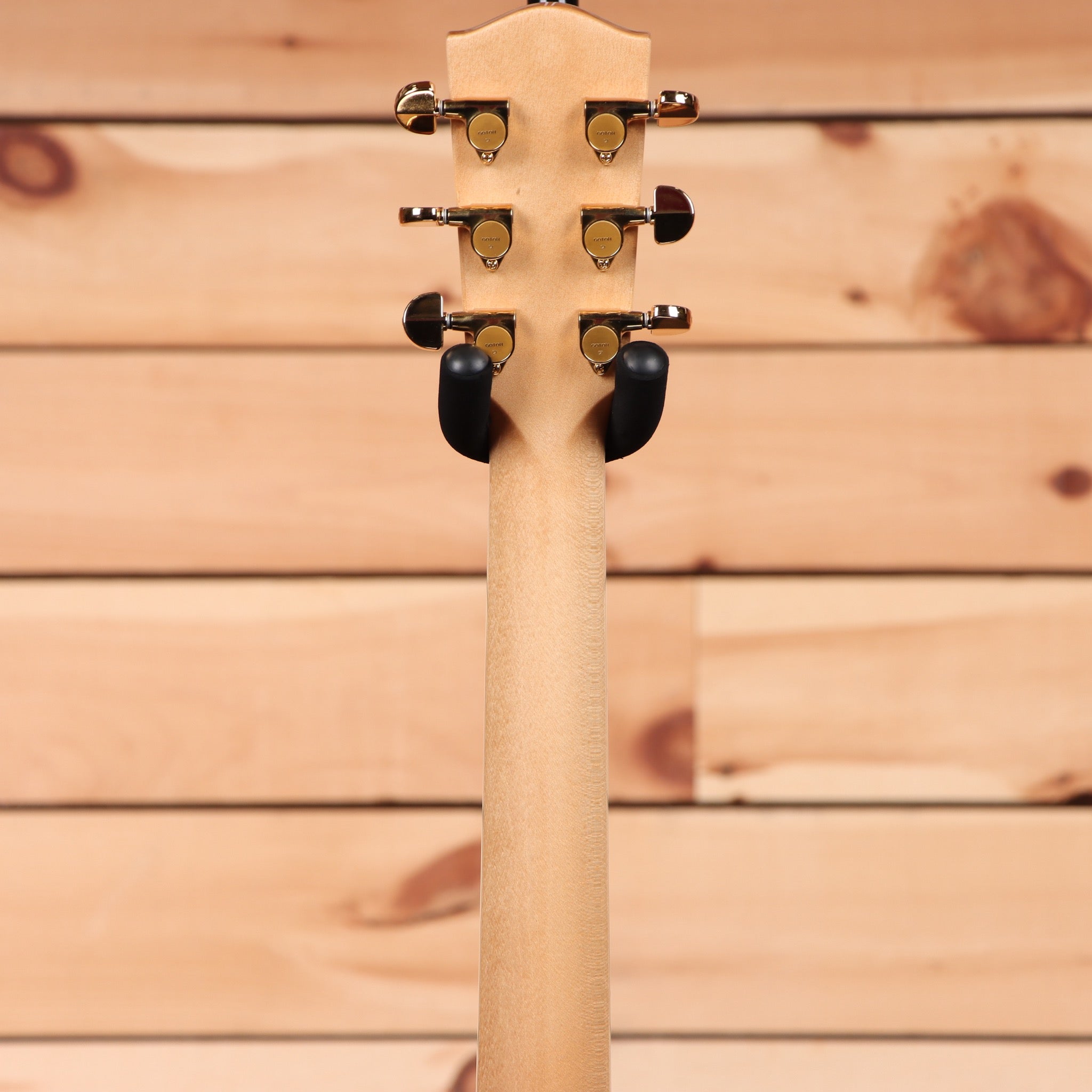 Eastman AC630 acoustic guitar natural finish with gold tuning machines and black button pegs