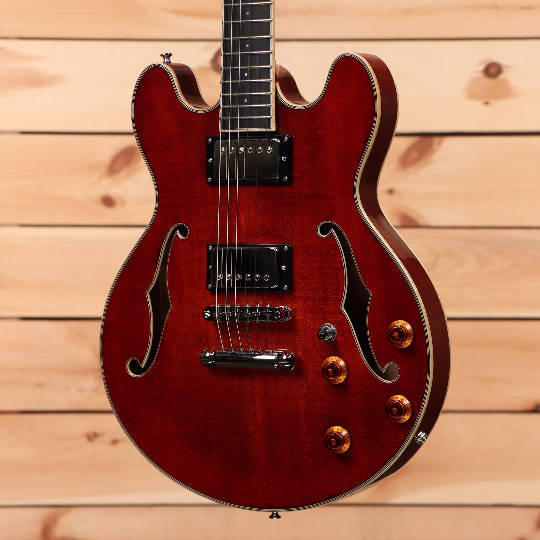 Eastman T184MX semi-hollow body electric guitar classic red finish with f-holes and amber knobs