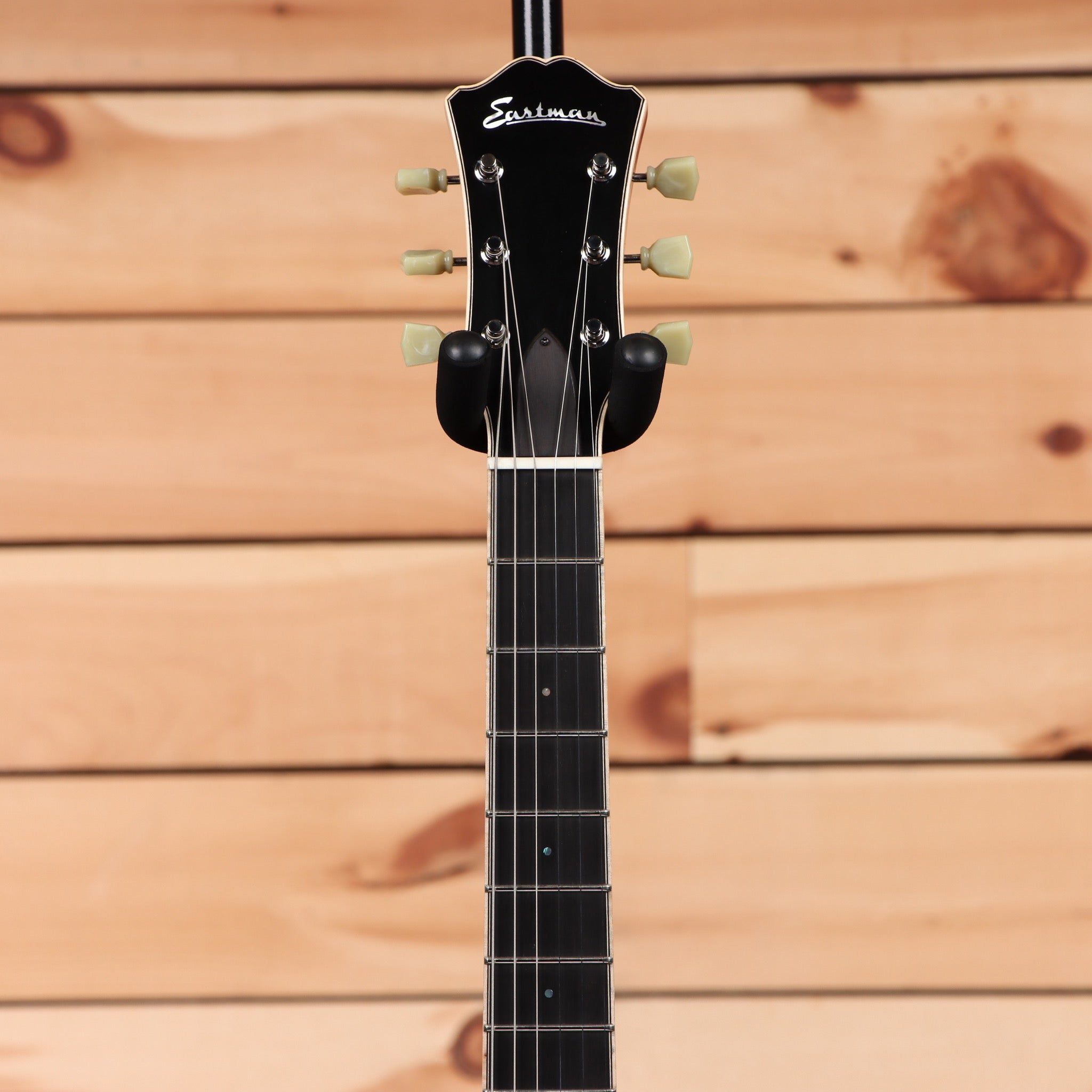 Eastman T184MX classic semi-hollow electric guitar with cream tuning pegs and black pickguard