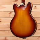 Eastman T64-V semi-hollow electric guitar Antique Goldburst with f-holes and cream binding