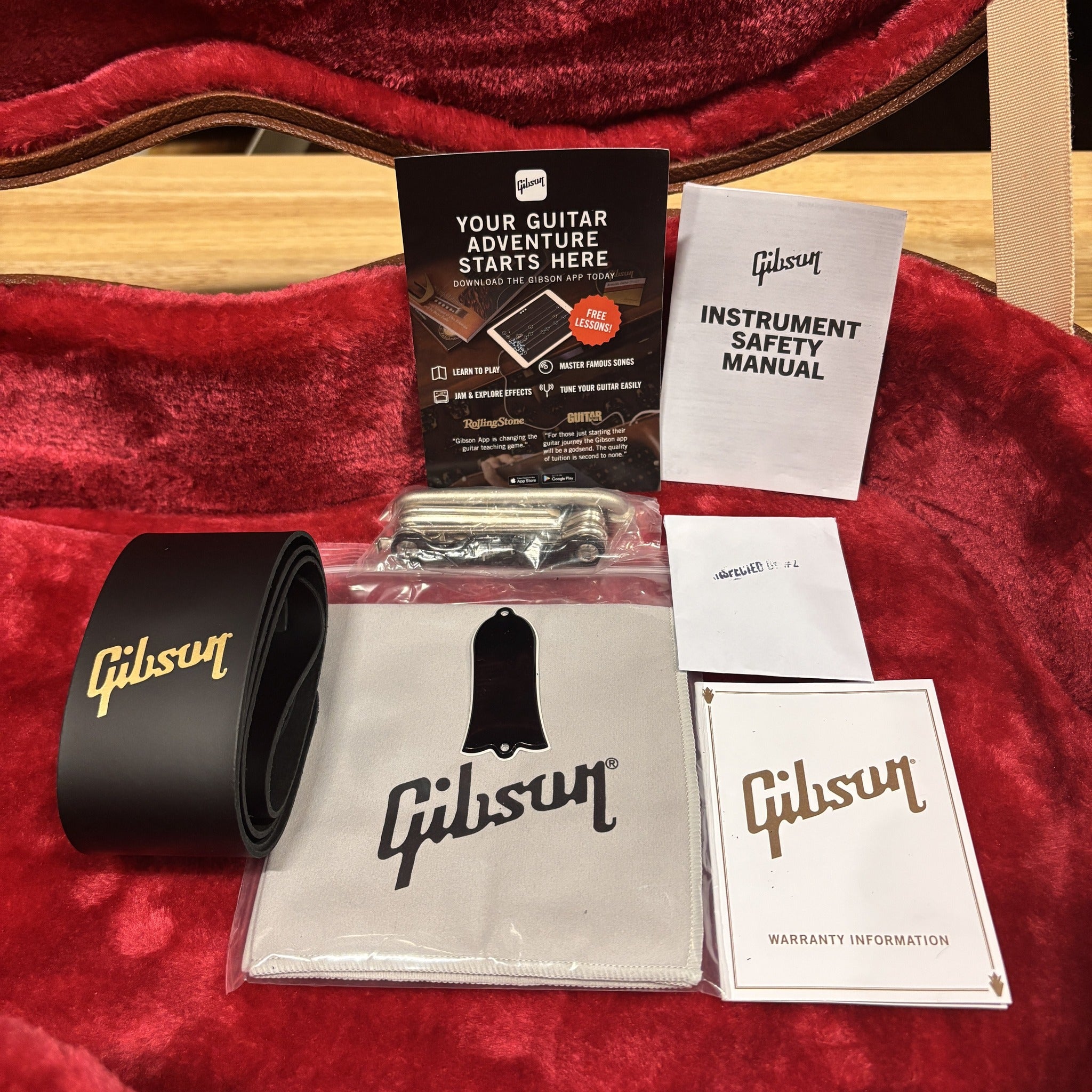 Gibson Les Paul Standard 50s Heritage Cherry Sunburst case candy with strap, polishing cloth, truss rod cover, and manuals
