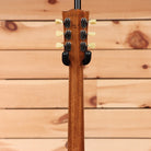 Gibson Les Paul 70s Deluxe Gold Top electric guitar with dual humbuckers and black rear view on wooden background