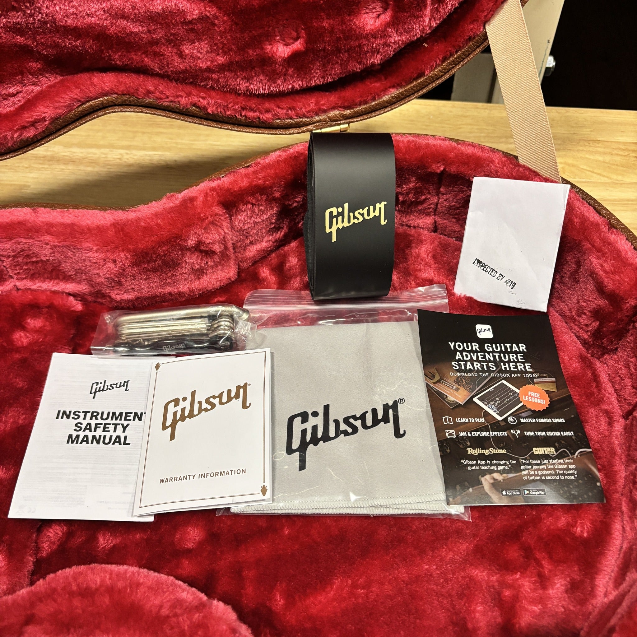 Gibson Les Paul Special TV Yellow guitar case interior with included accessories manual warranty card and polishing cloth