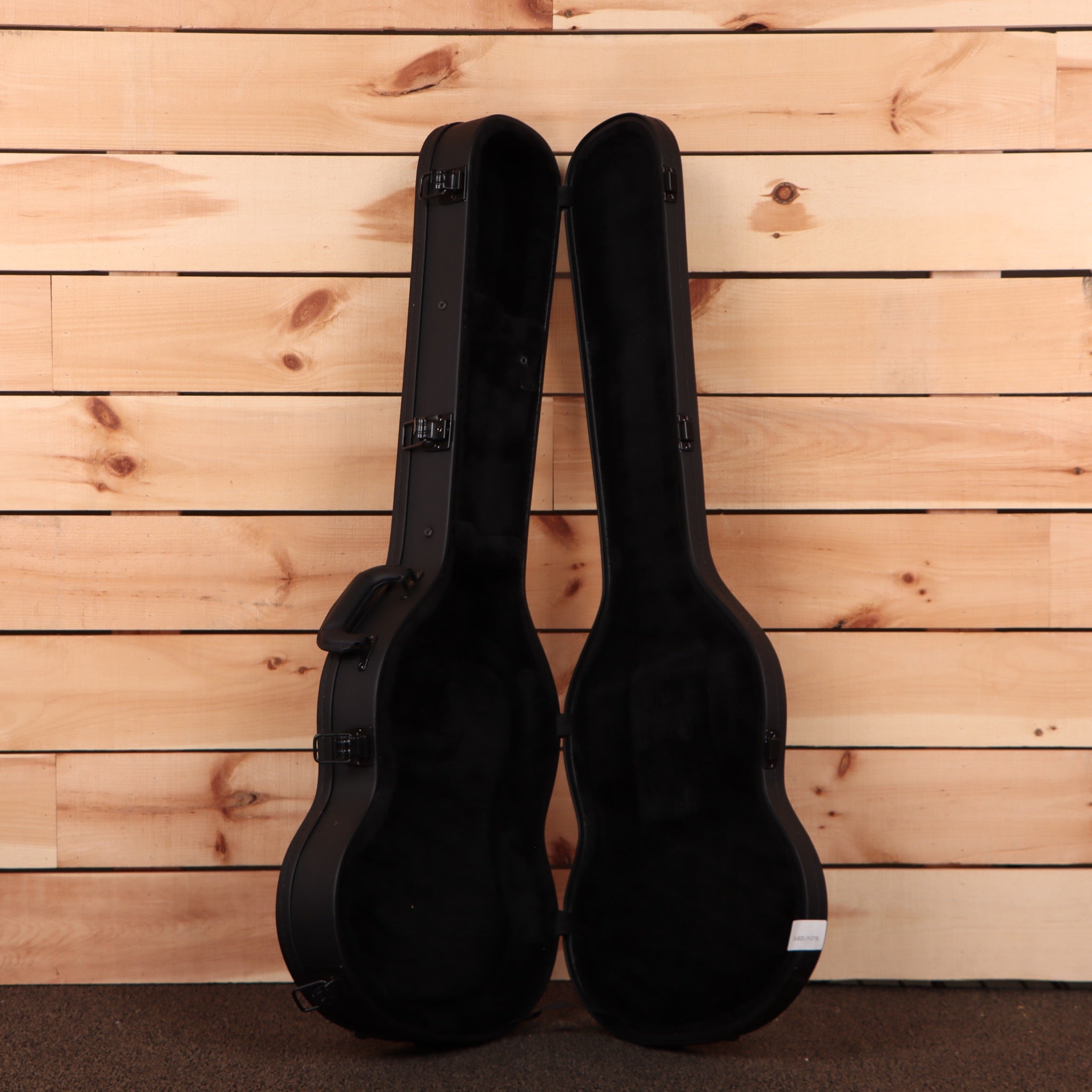 Gibson SG Modern Trans Black Fade electric guitar with dual humbuckers and hard cases