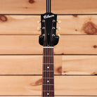 Gibson J-35 acoustic guitar vintage sunburst with rosewood fretboard and cream tuning pegs