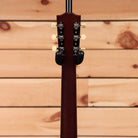 Gibson J-35 acoustic guitar vintage sunburst with cream tuning pegs and black headstock