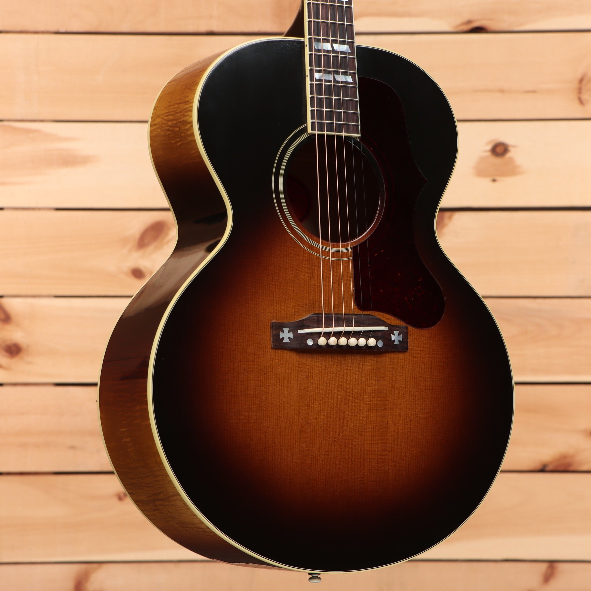 Gibson J-185 acoustic guitar vintage sunburst with black pickguard and cream binding