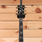 Gibson Doves in Flight acoustic guitar Antique Natural with inlaid bird fretboard inlays and gold tuners