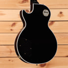Gibson Les Paul Custom ebony electric guitar with gold hardware and white binding