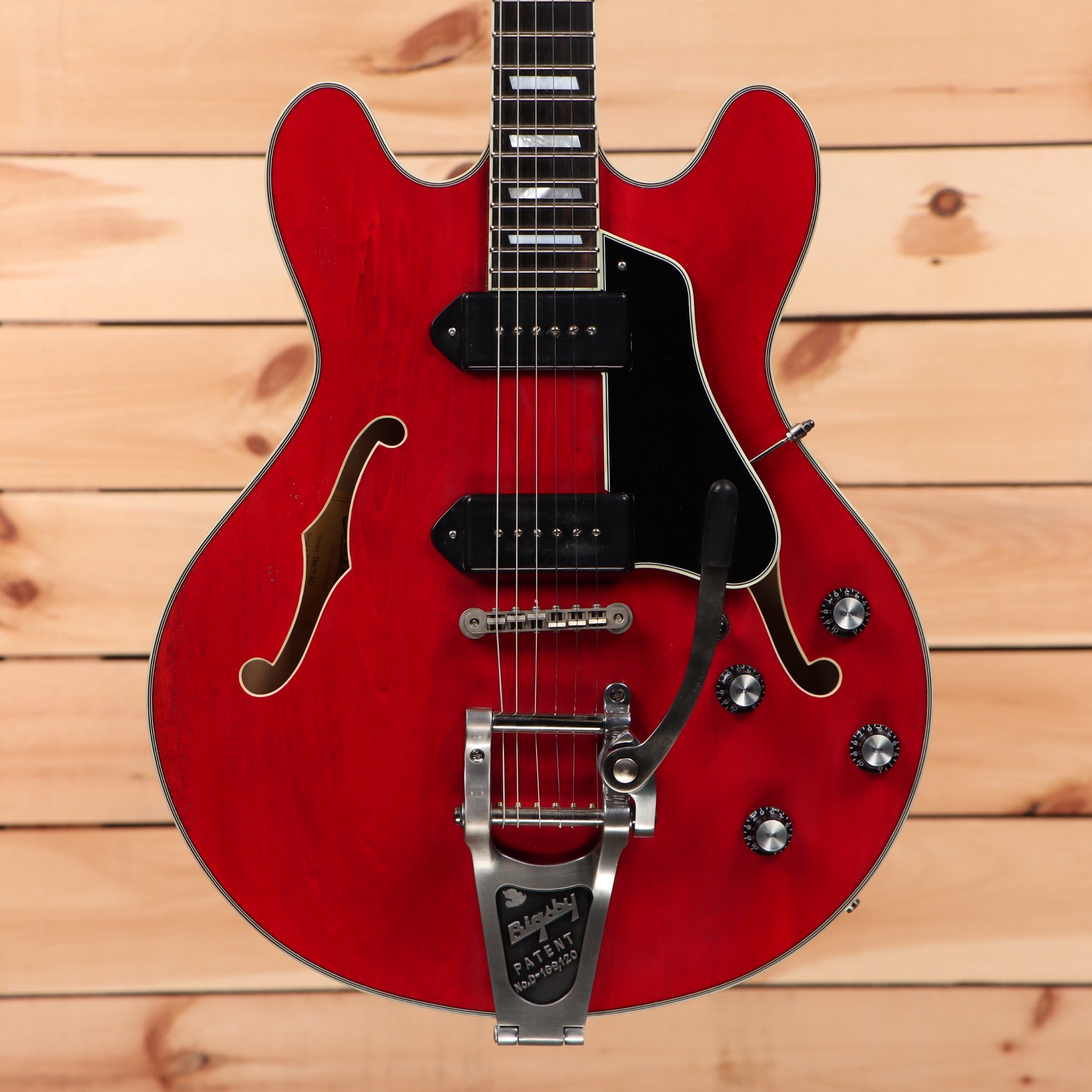 Eastman T64VRD semi-hollow electric guitar antique red with f-holes and bigsby tremolo bridge