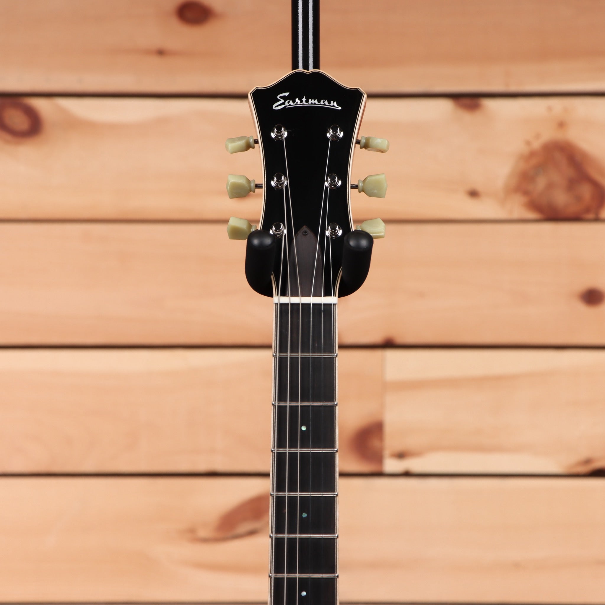 Eastman T186mx semi-hollow electric guitar Goldburst with cream tuning pegs and black headstock