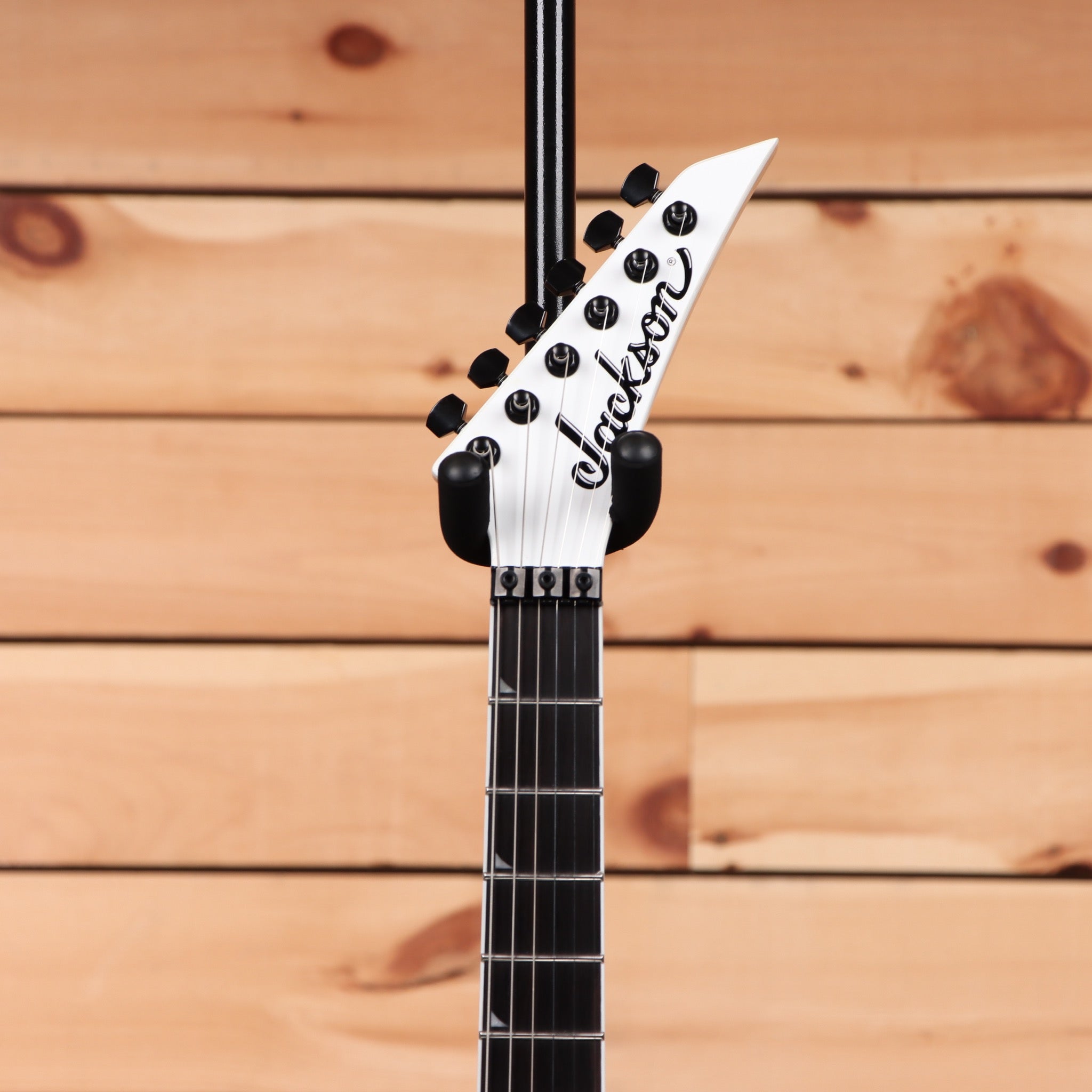 Jackson Pro Plus Series Soloist SLA3 electric guitar Snow White with pointed headstock and black hardware