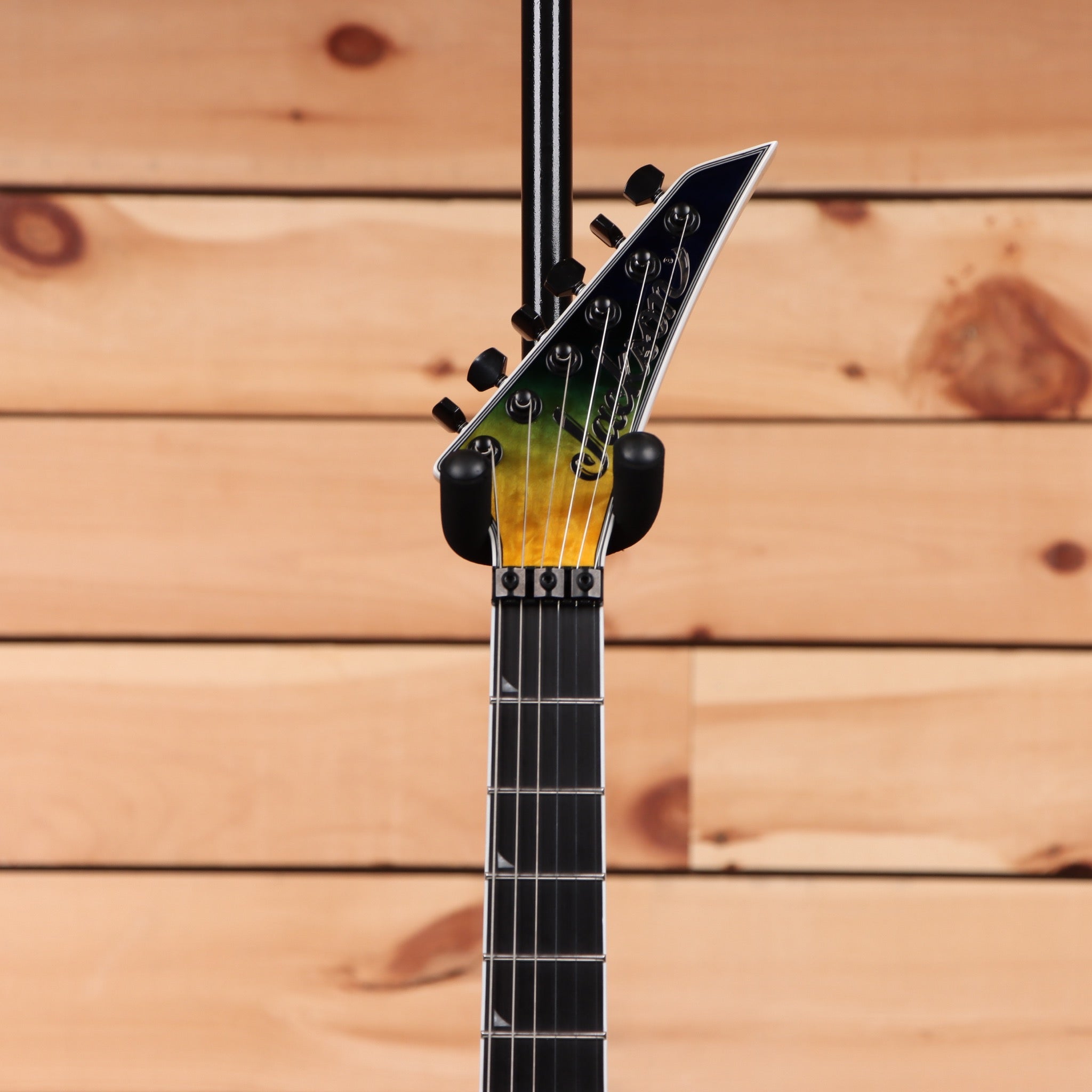 Jackson Pro Plus Series Soloist SLA3Q electric guitar Amber Blue Burst with pointed headstock and maple neck