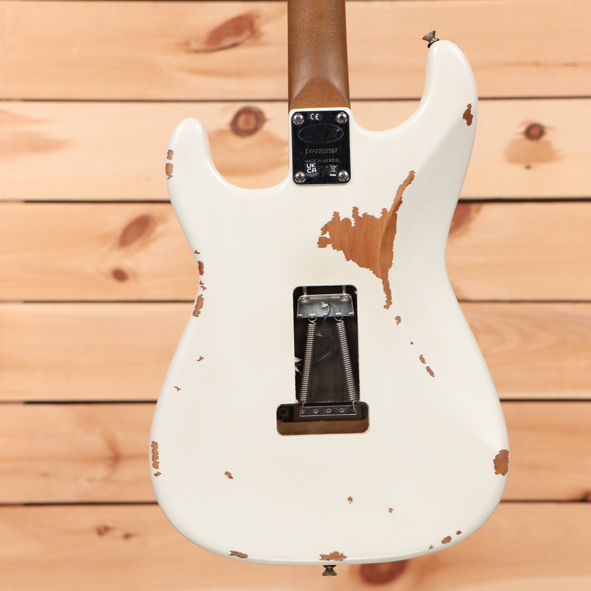 EVH Frankenstein Relic Series white electric guitar Stratocaster with heavy distressed finish and tremolo bridge