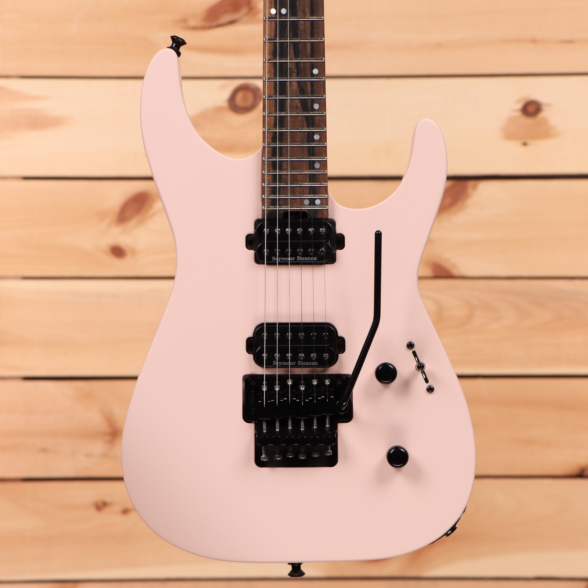 Jackson American Series Virtuoso Satin Shell Pink electric guitar with dual Seymour Duncan humbuckers