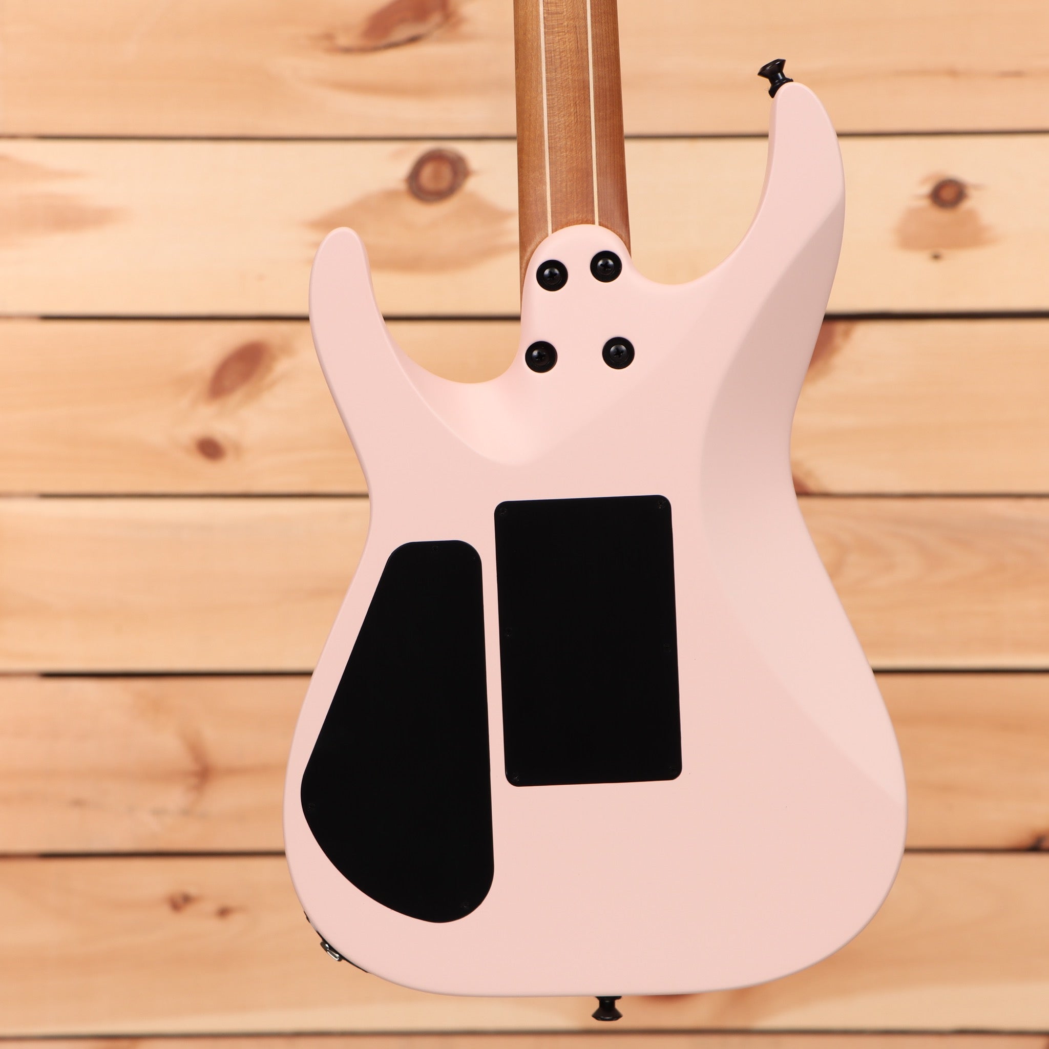 Jackson American Series Virtuoso Satin Shell Pink electric guitar with dual humbucker pickups