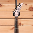 Jackson American Series Virtuoso electric guitar Satin Shell Pink with pointed headstock and black tuning machines