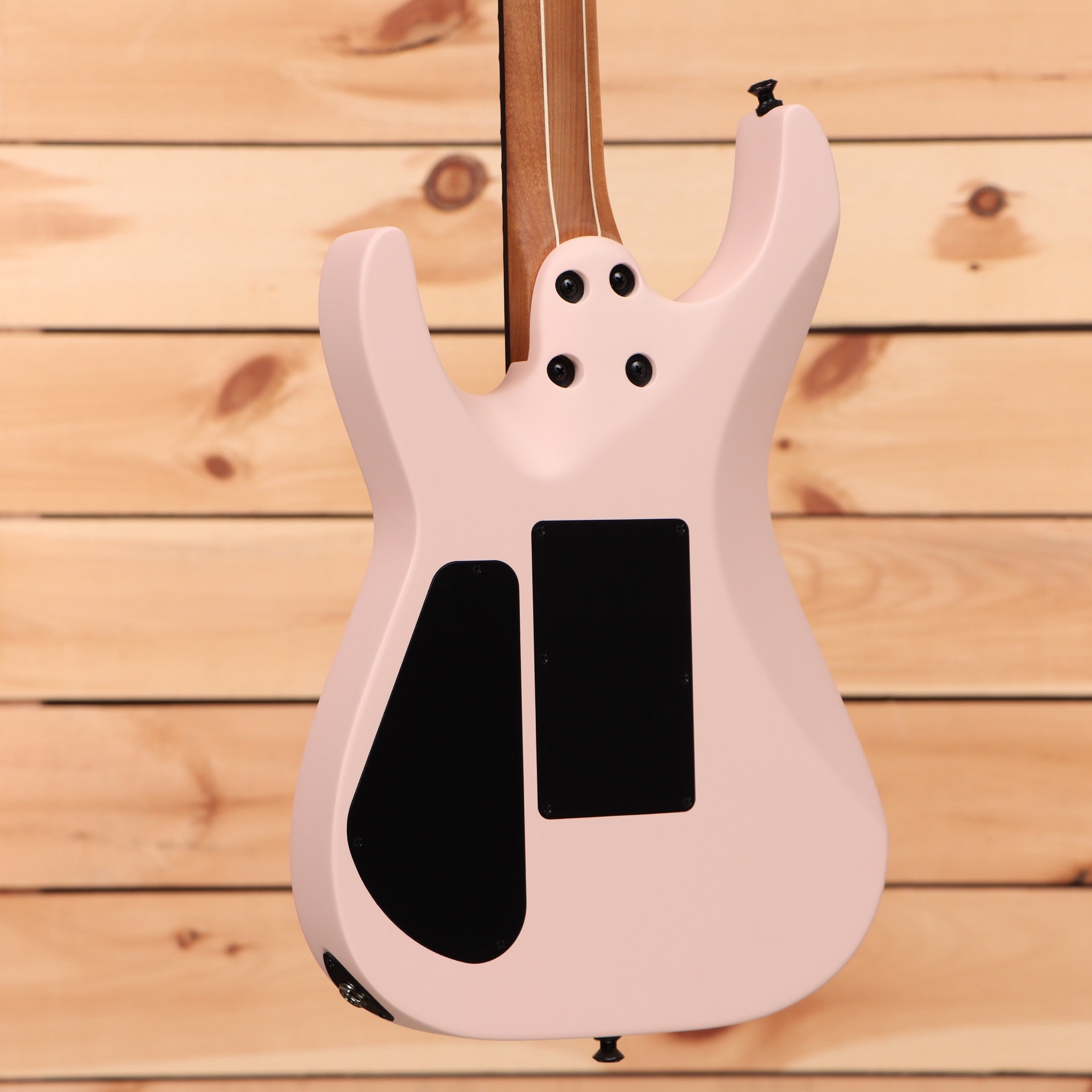 Jackson American Series Virtuoso Satin Shell Pink electric guitar with dual humbucker pickups