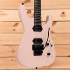 Jackson American Series Virtuoso Satin Shell Pink electric guitar with black humbucker pickups and floyd rose tremolo system