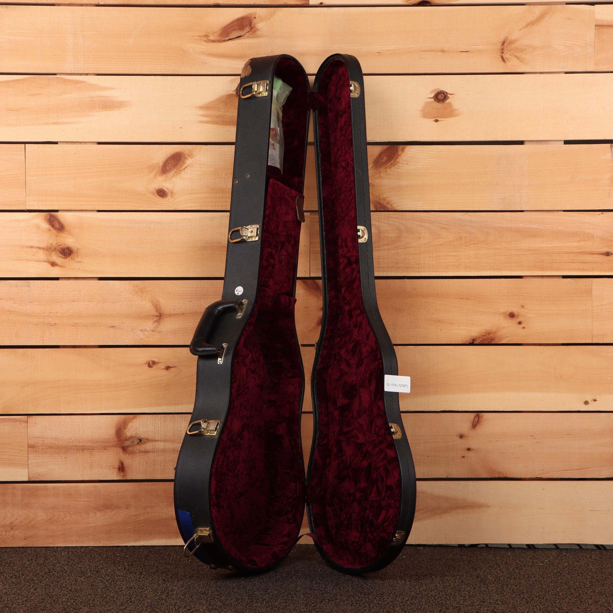 Gibson Inspired By Joe Bonamassa Les Paul Goldtop hard case open showing burgundy velvet interior with gold hardware latches