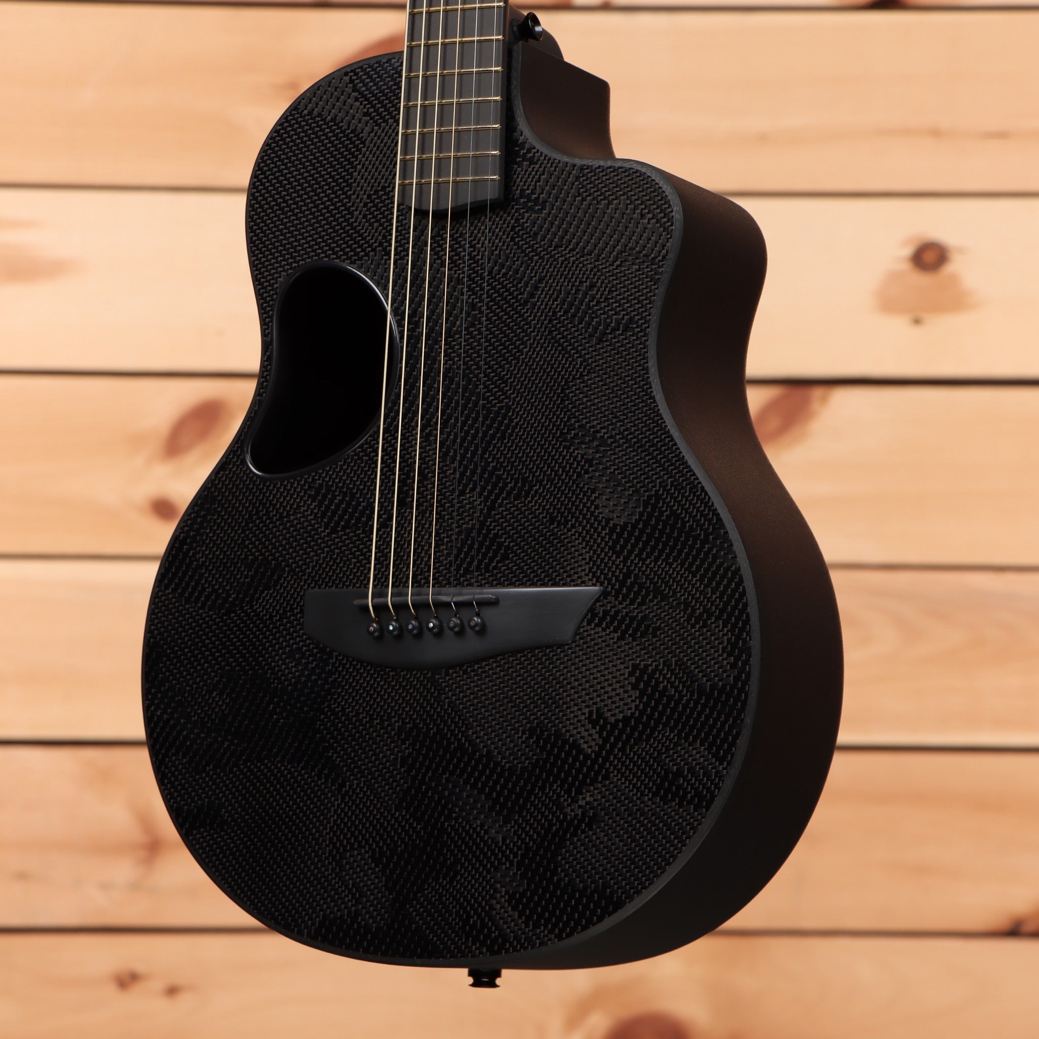 McPherson Carbon Touring Camo acoustic guitar carbon fiber construction with cutaway body