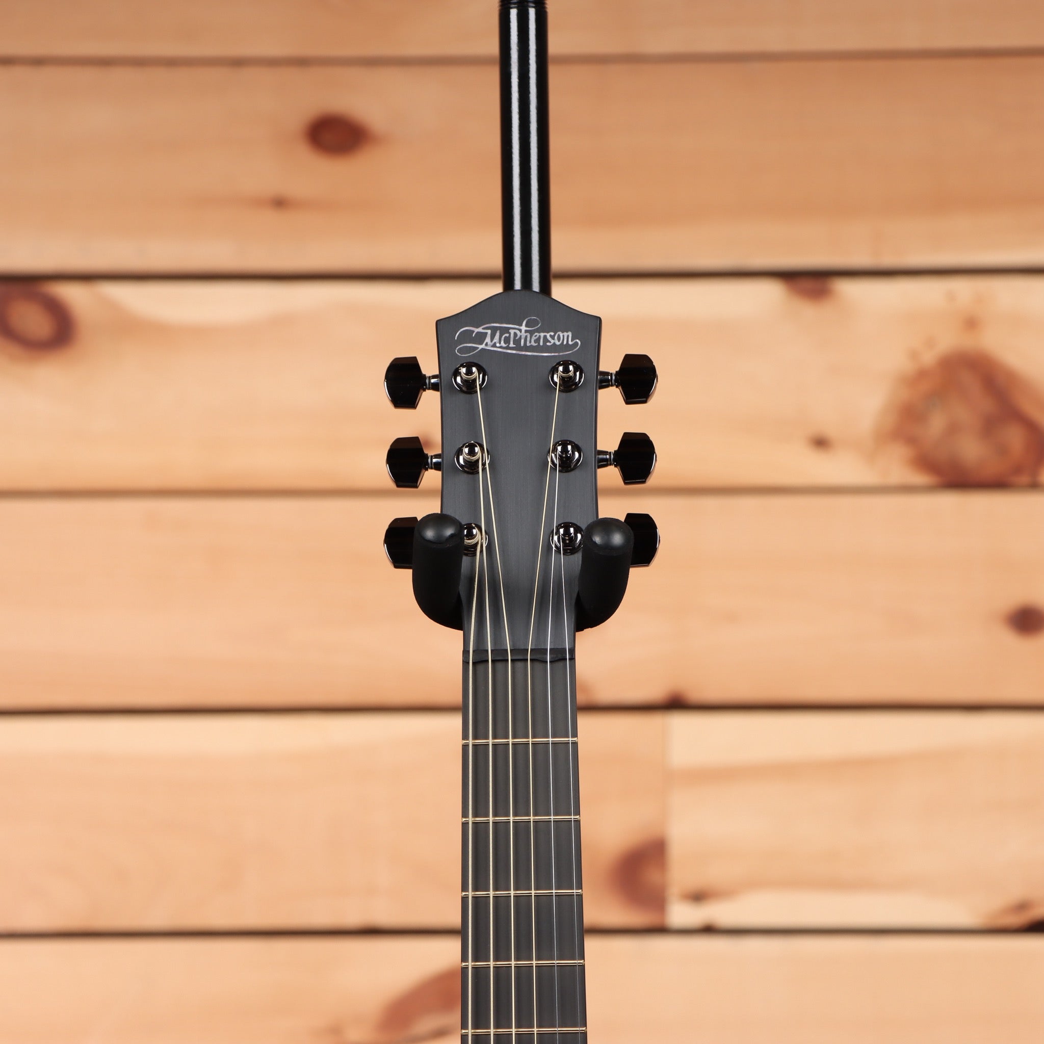 McPherson Carbon Touring Camo acoustic guitar with black headstock and ebony fretboard