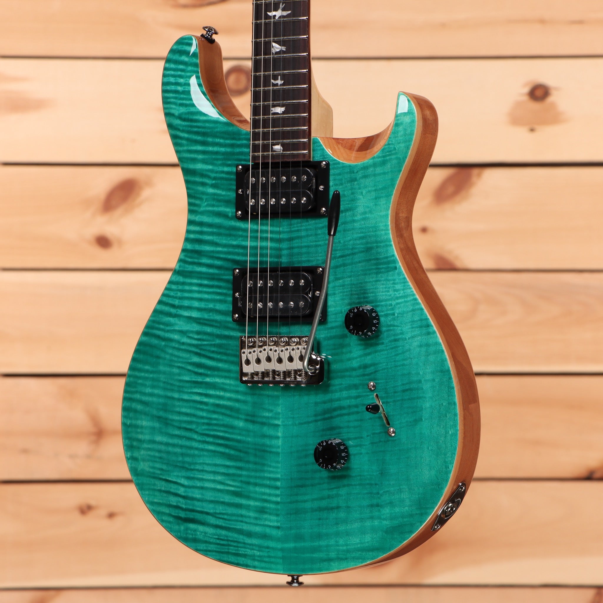 Paul Reed Smith SE Custom 24 turquoise electric guitar with flame maple top and dual humbucker pickups