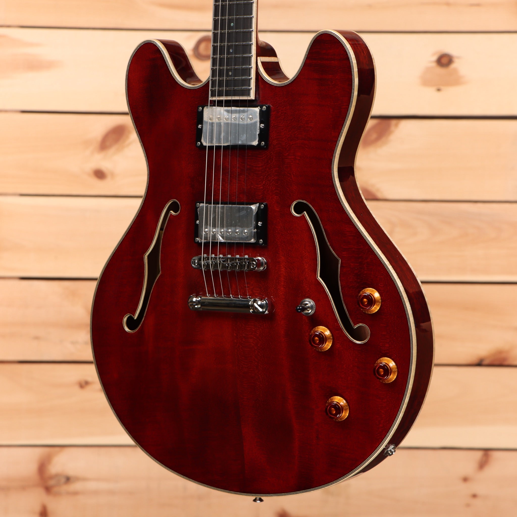 Eastman T186MX Classic semi-hollow electric guitar with burgundy finish and dual humbucker pickups