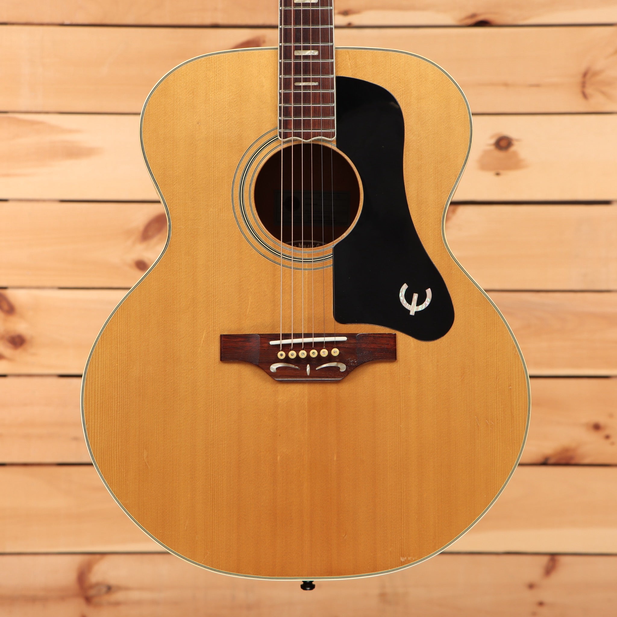 Epiphone FT-570BL jumbo acoustic guitar Natural finish with large black pickguard and rosewood bridge