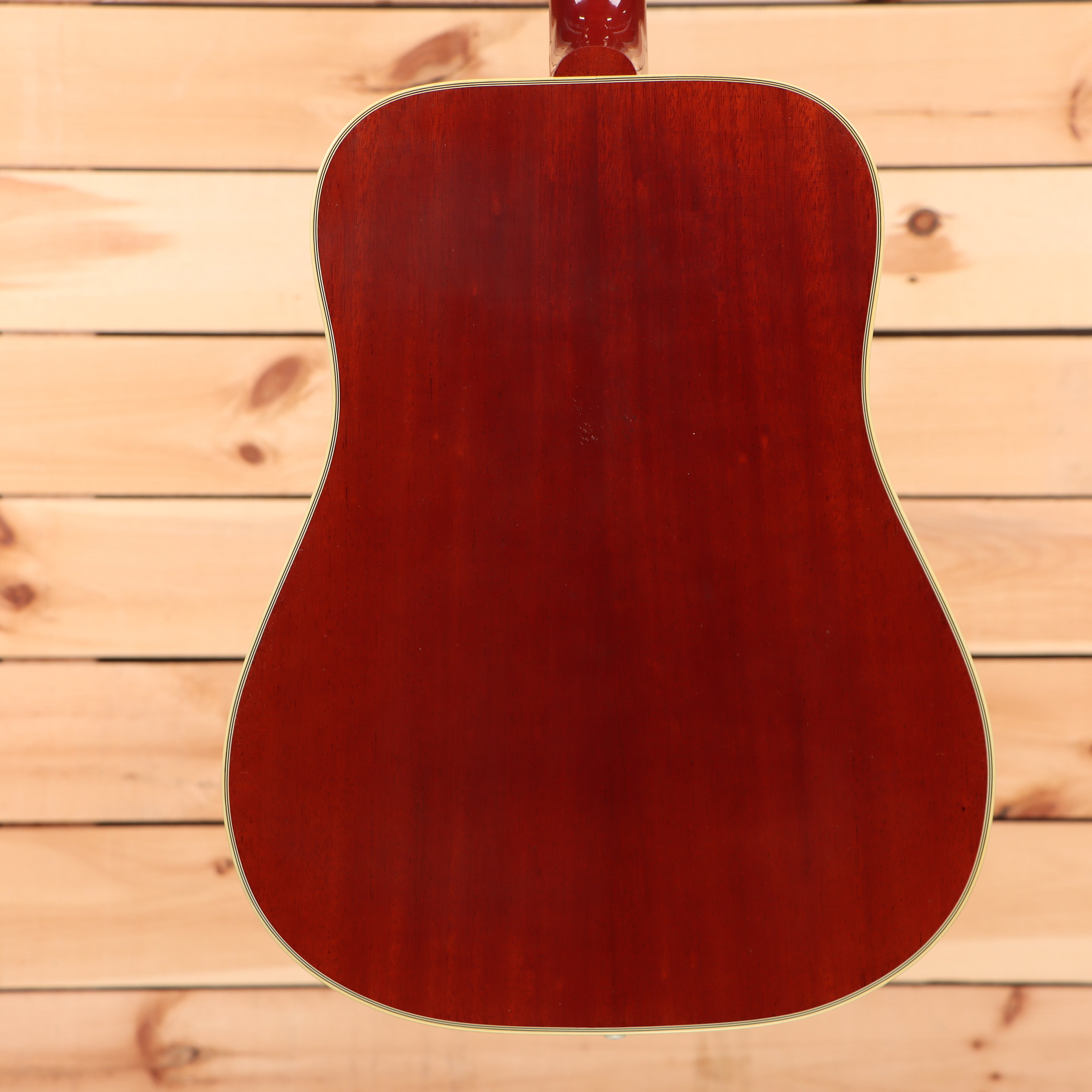 Gibson 1960 Hummingbird light-aged heritage cherry sunburst acoustic guitar with dreadnought body and gold hardware binding