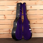 Gibson J-45 acoustic guitar case with purple velvet interior and black exterior