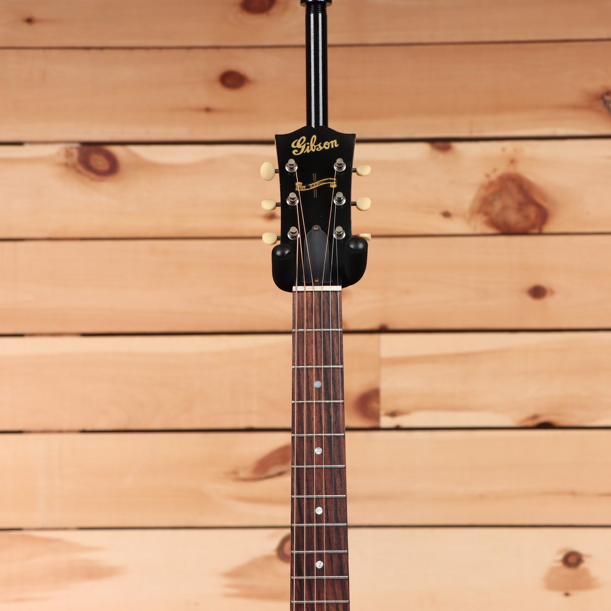 Gibson J-45 acoustic guitar light aged vintage sunburst with rosewood fretboard and cream binding