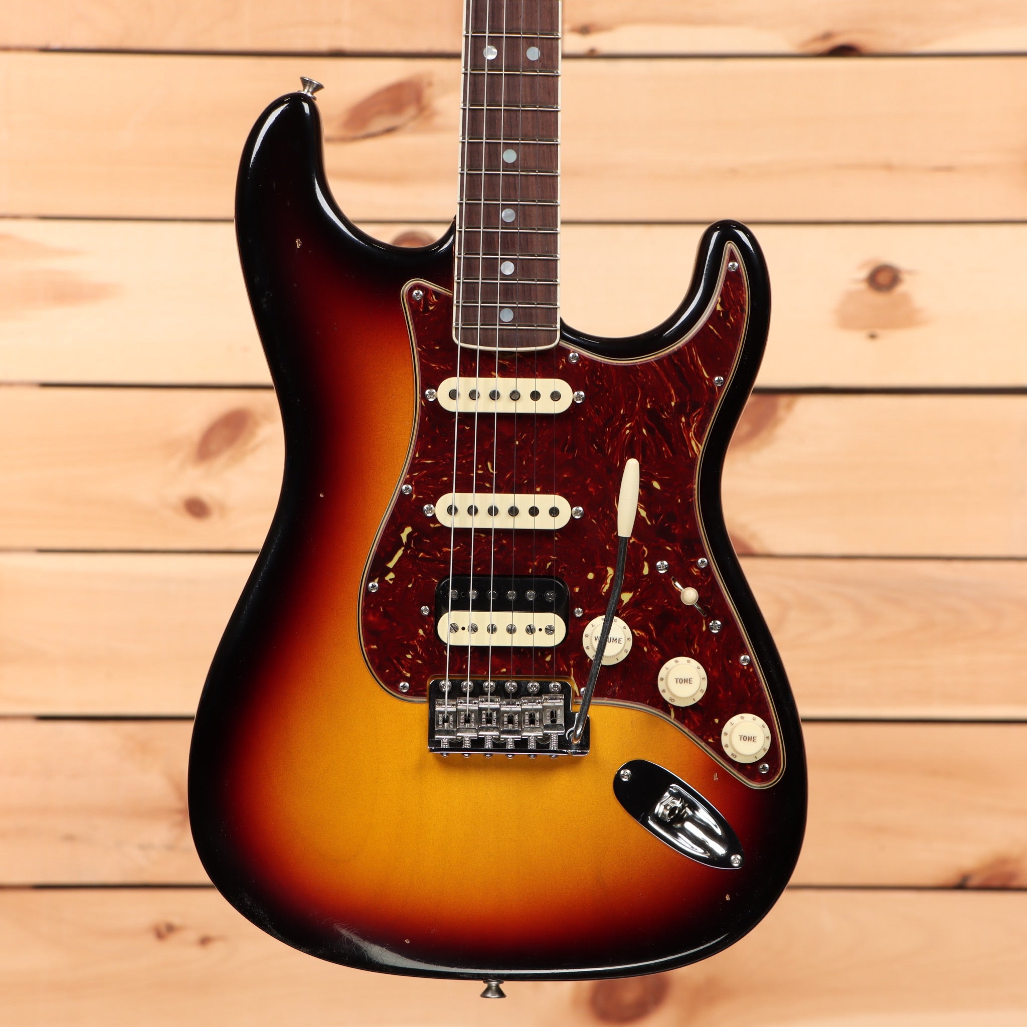 Fender Custom Shop Limited 1967 HSS Stratocaster Journeyman Relic 3-Color Sunburst electric guitar with single-coil pickups and tremolo bridge