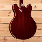 Eastman T186MX Classic semi-hollow body electric guitar with dark red finish and maple neck binding