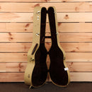 Huss and Dalton Tom Custom acoustic guitar natural finish with case open showing dark interior