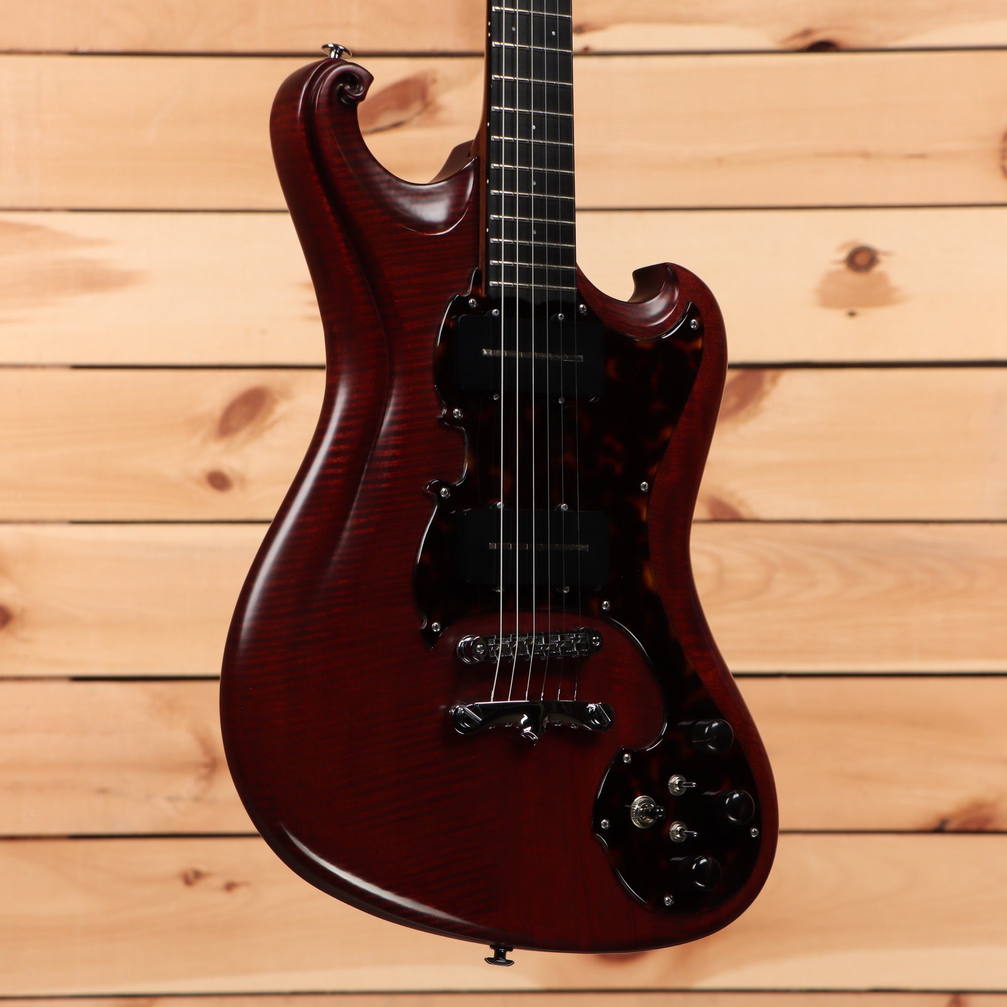 Scott Walker Phoenix mahogany electric guitar with flamed maple top and black pickguard