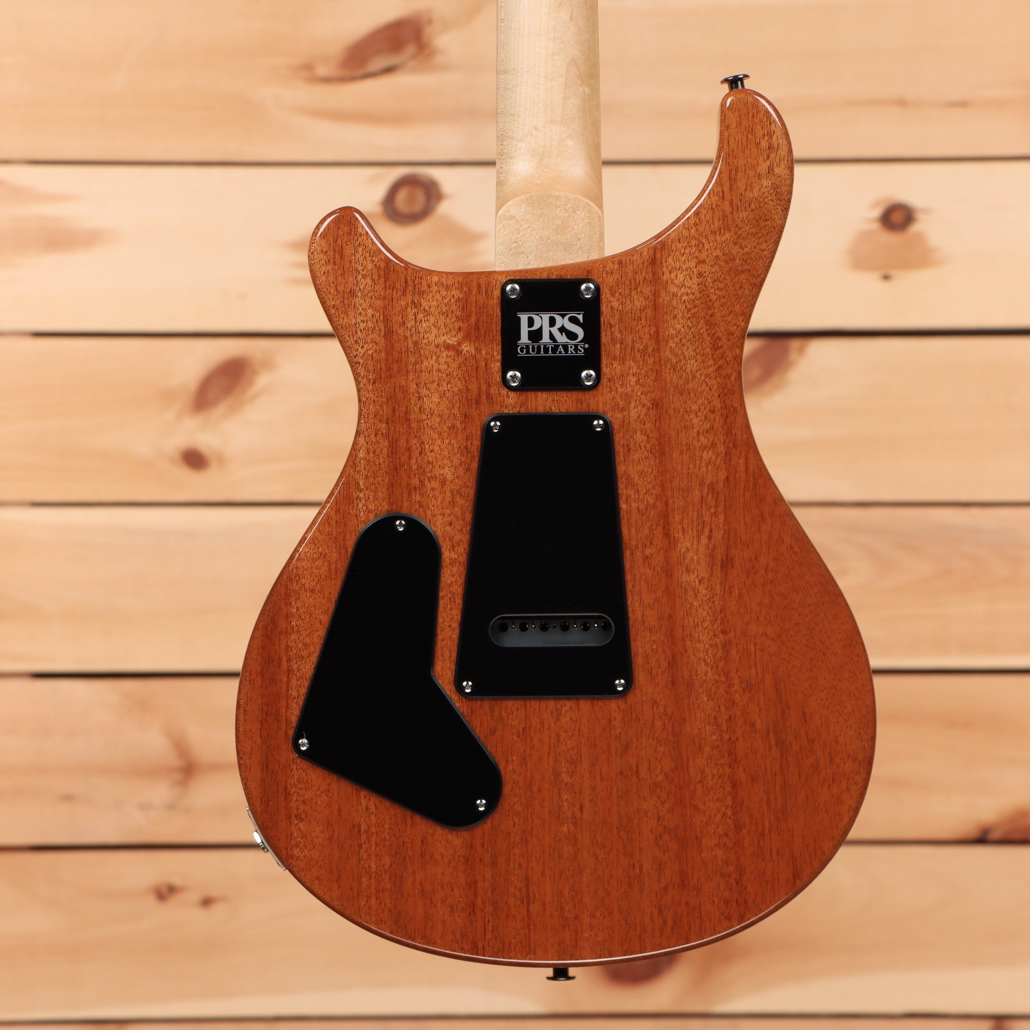 Paul Reed Smith CE 24 electric guitar Terracotta Metallic with single-coil pickup and figured mahogany body