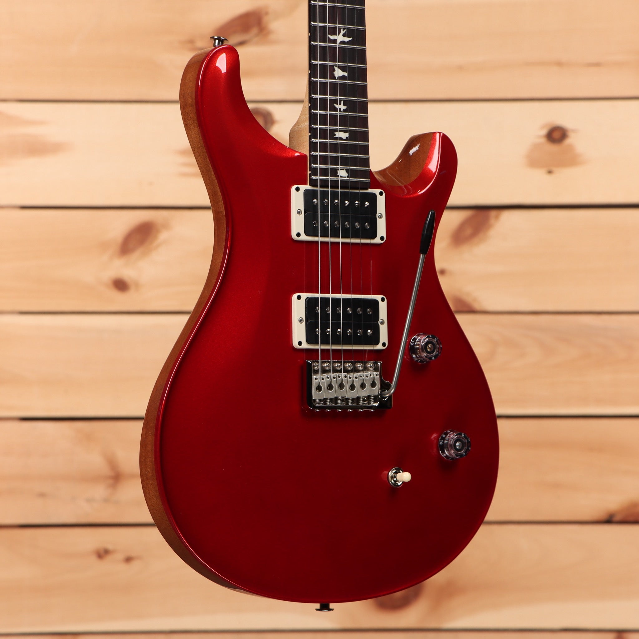 Paul Reed Smith CE 24 electric guitar Terracotta Metallic finish with dual humbucker pickups and tremolo bridge
