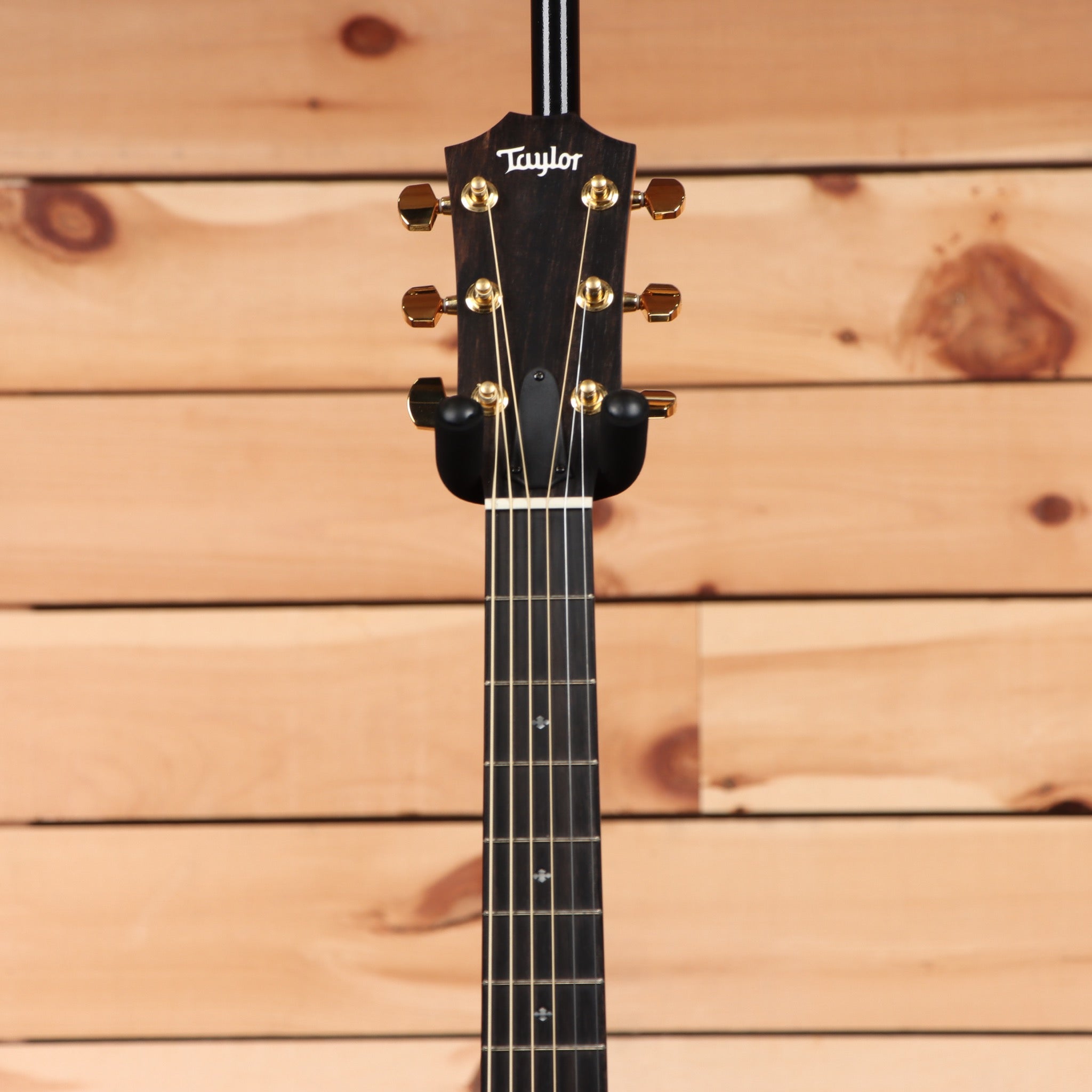 Taylor 214ce Deluxe pre-owned acoustic-electric guitar natural finish with gold tuning machines