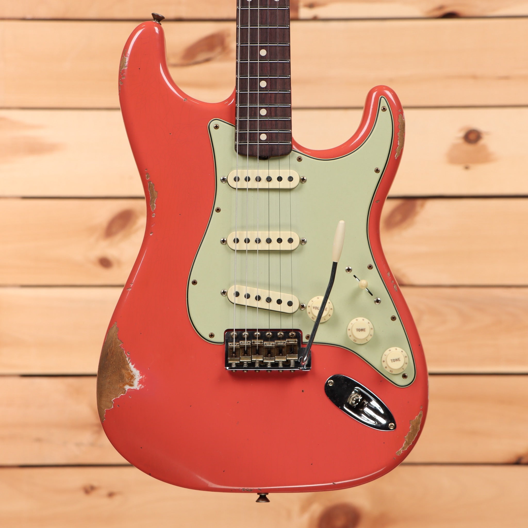 Fender Custom Shop Limited 1960 Stratocaster Relic electric guitar Tahitian Coral with mint green pickguard and single-coil pickups