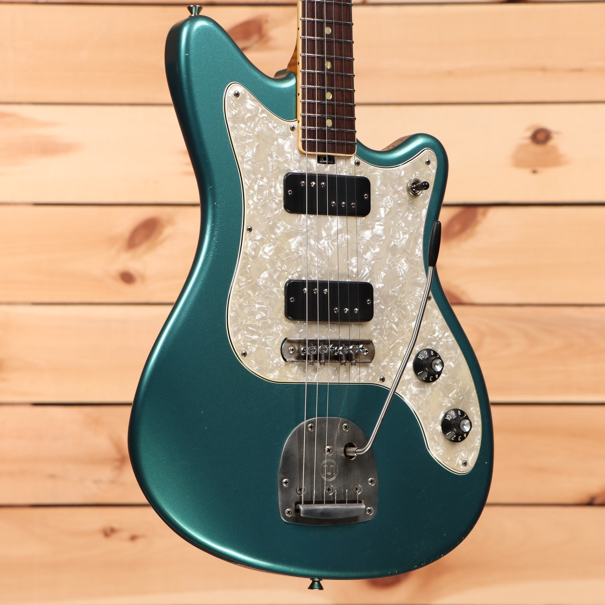 Squier Paranormal Toronado electric guitar Ocean Turquoise with pearloid pickguard and dual humbuckers