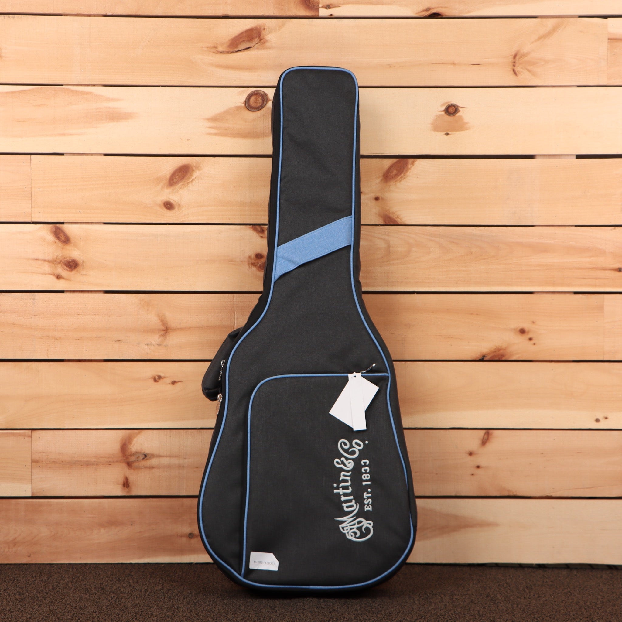 Martin 000X2E concert acoustic guitar natural finish with blue-lined gig bag