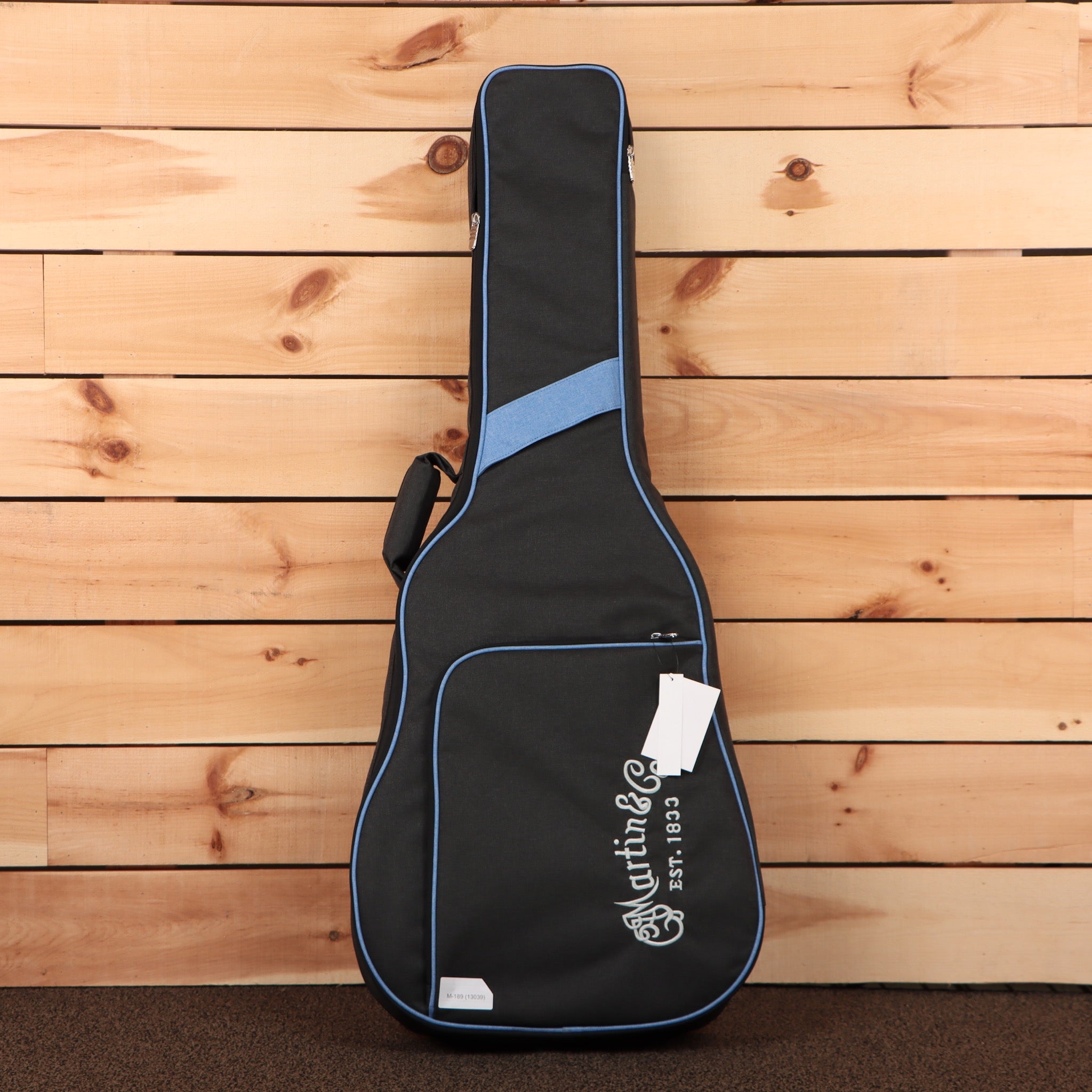 Martin DX2E 12-string acoustic guitar case black with blue piping and shoulder strap