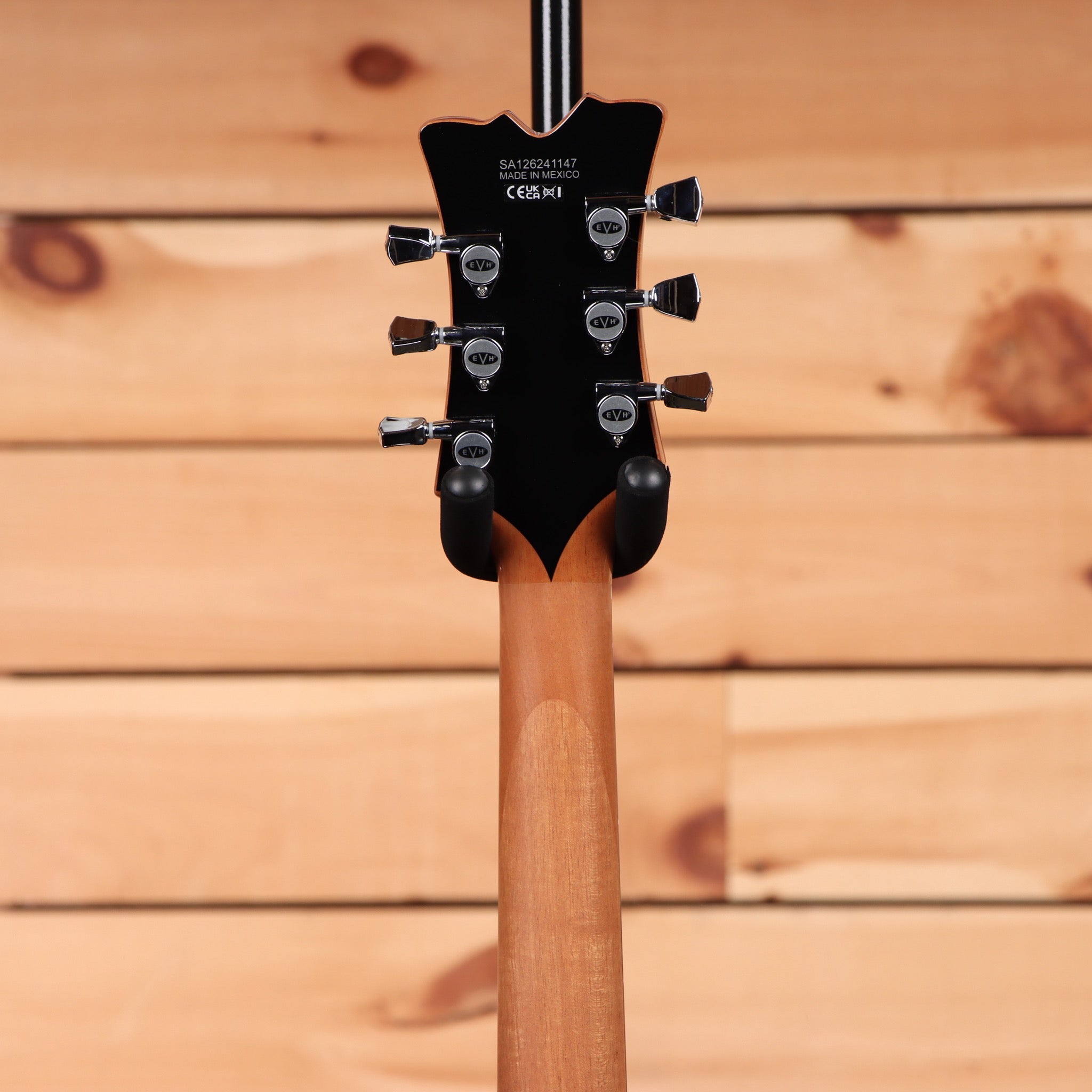 EVH SA126 electric guitar transparent purple with black headstock and chrome tuning machines