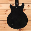 Gibson 1958 Les Paul Junior Doublecut VOS electric guitar Ebony Sparkle with P90 pickup and semi-hollow body cutaway