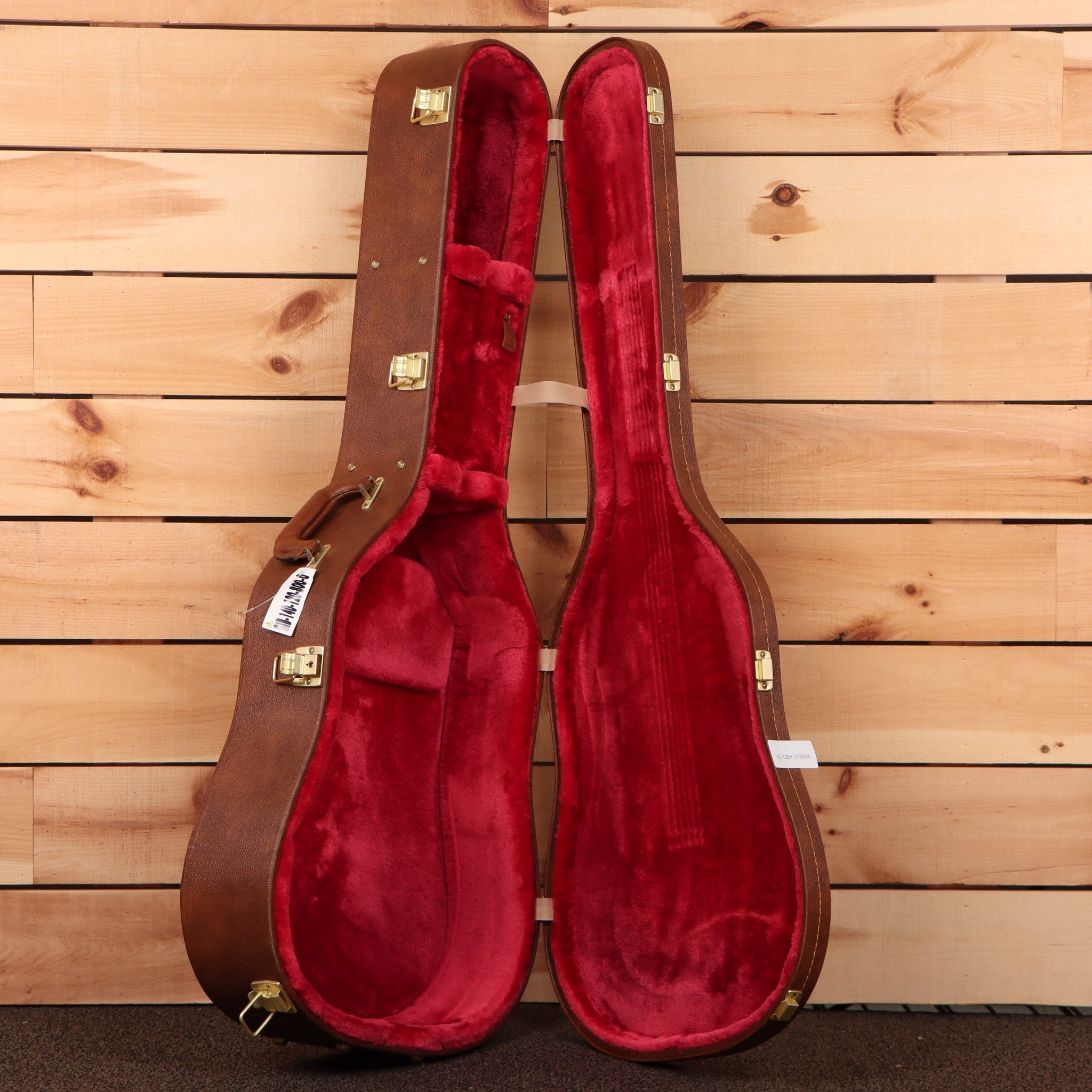 Gibson Dove Original acoustic guitar Trans Ebony with red velvet-lined hardshell case