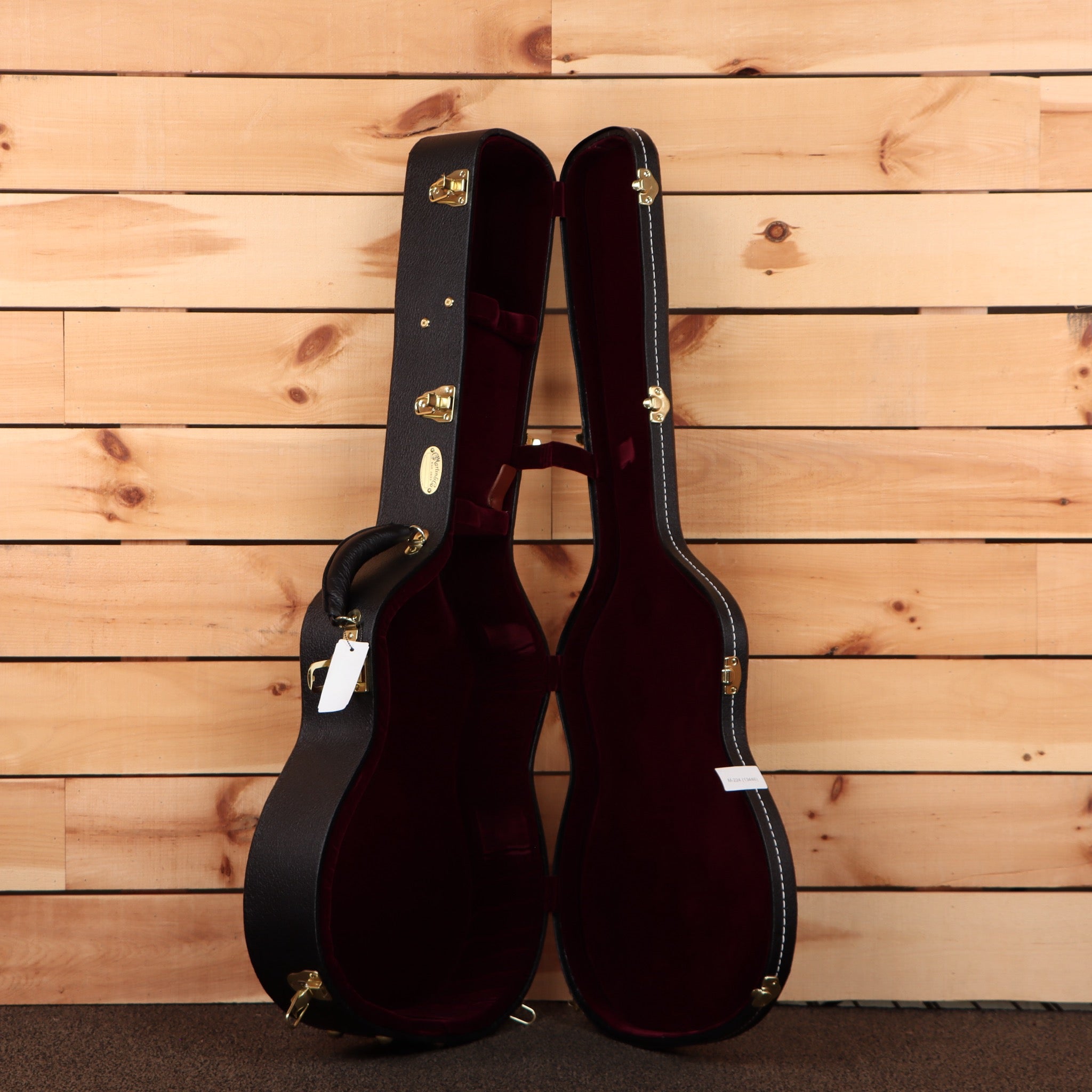 Martin OM28 Modern Deluxe acoustic guitar natural finish with burgundy velvet-lined hard case